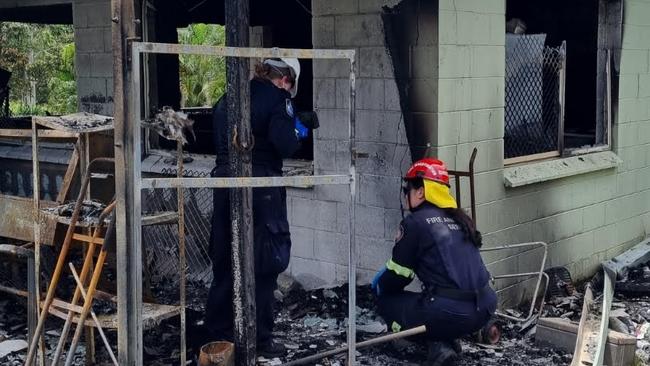 A joint investigation into a house fire at Koah was underway on February 28, between Queensland Fire and Rescue Service and Queensland Police at Barron St, Koah, on February 28, 2023. QFES Fire Investigator Aeron Holzhauser (in red and yellow helmet) with a Mareeba Scenes of Crime officer (white helmet) conduct their investigation. Picture: Supplied