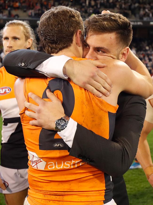 Stephen Coniglio embraces teammate Jacob Hopper after the preliminary final. Picture: Michael Willson/AFL Photos via Getty Images.