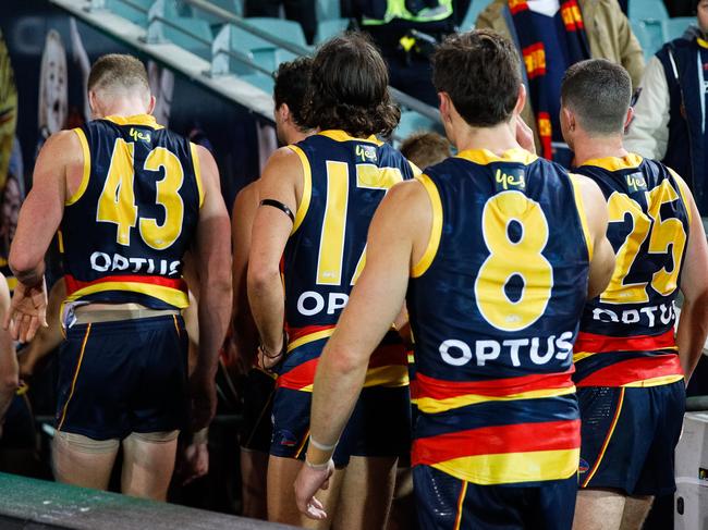 ADELAIDE, AUSTRALIA - JULY 20: Adelaide Crows players  walk from the ground during the round 7 AFL match between the Adelaide Crows and the St Kilda Saints at Adelaide Oval on July 20, 2020 in Adelaide, Australia. (Photo by Daniel Kalisz/Getty Images)