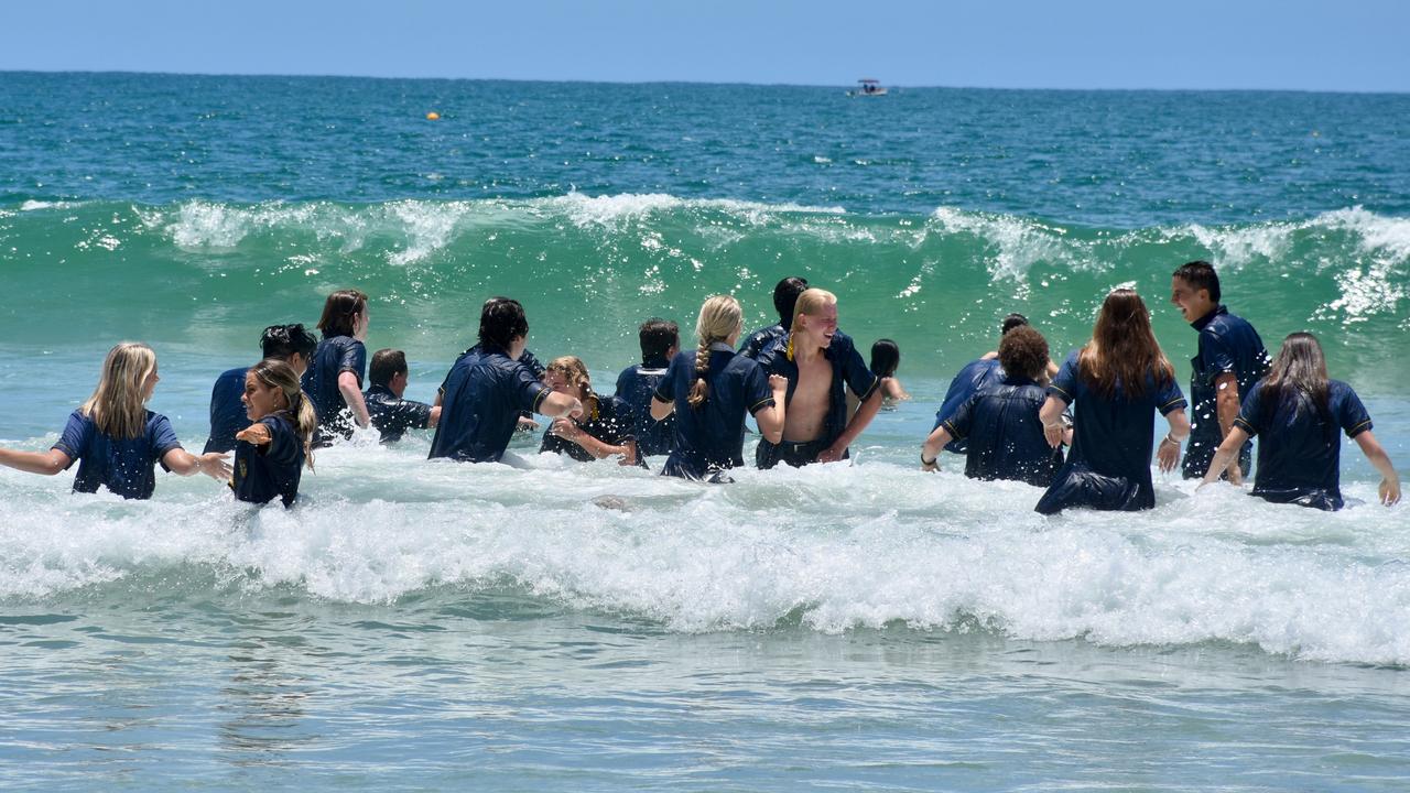 Year 12 graduates from schools across the Sunshine Coast hit to the water at Mooloolaba Beach to celebrate the end of their schooling. Photo: Mark Furler