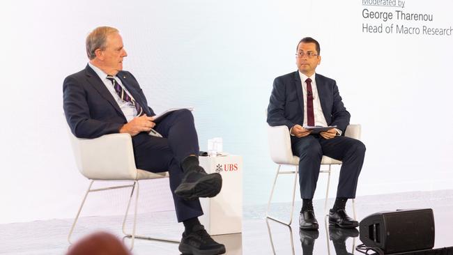 Future Fund chairman Peter Costello, left, speaks with UBS economist George Tharenou at the UBS Australasia conference on Monday. Picture: Scott Ehler