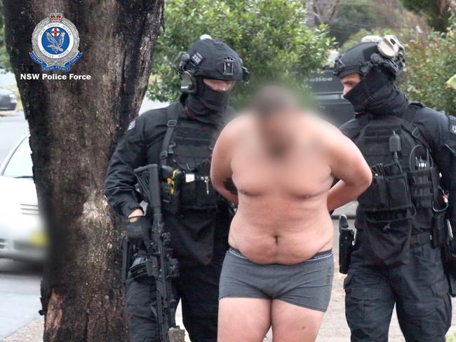 Tactical police arrest one of three men in July in relation to an alleged firearm supply syndicate. Picture: NSW Police