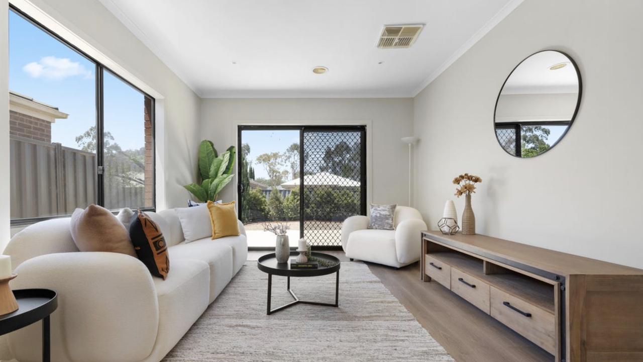 The living area of the Manor Lakes home is bright and airy.