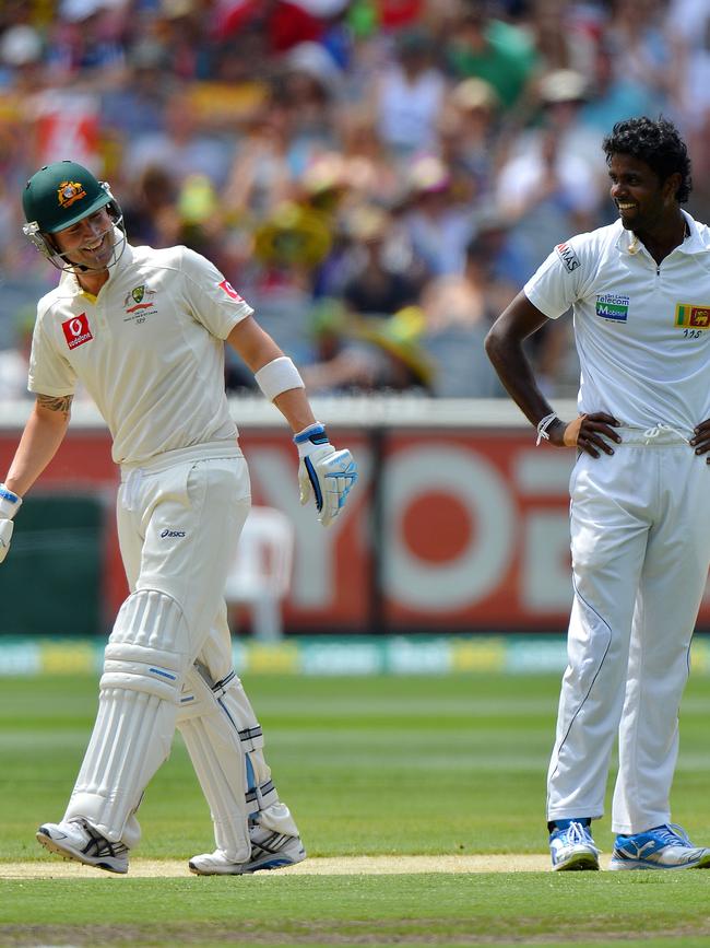 ... and has a laugh afterwards. Picture: AP Photo/Andrew Brownbill)