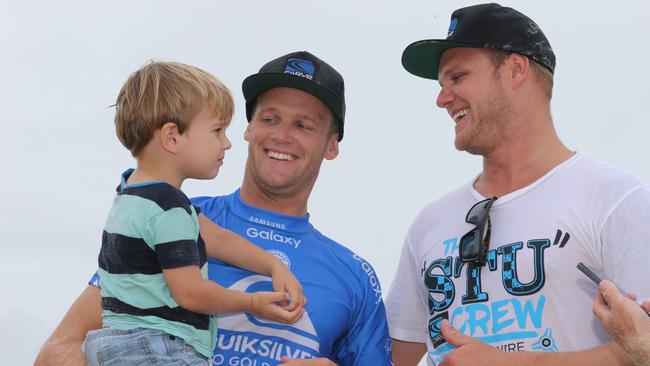 Semi Final of the Quiksilver Pro Surfing contest at Snapper Rocks on the Gold Coast and Stuart Kennedy fails to make the final. Stuart Kennedy and son Taj 2. Picture Glenn Hampson