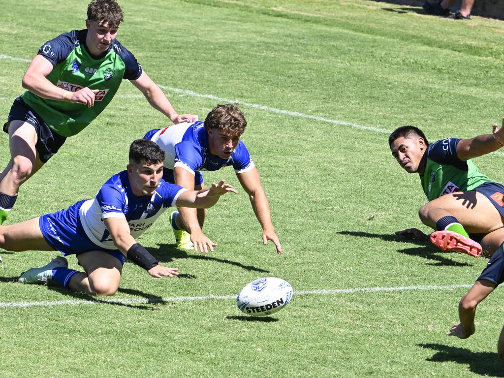 Alex Conti reaches out to ground the ball. Picture: Martin Ollman