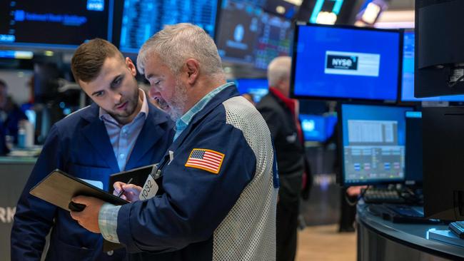 Traders assess contracts on the floor of the New York Stock Exchange. Picture: Getty Images