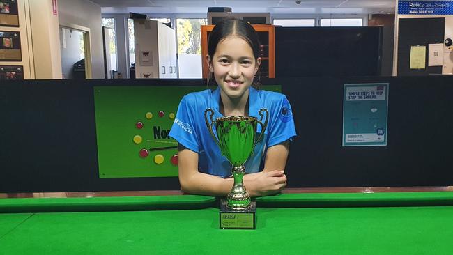 Lilly Meldrum with one of the many snooker and billiards trophies she has won.