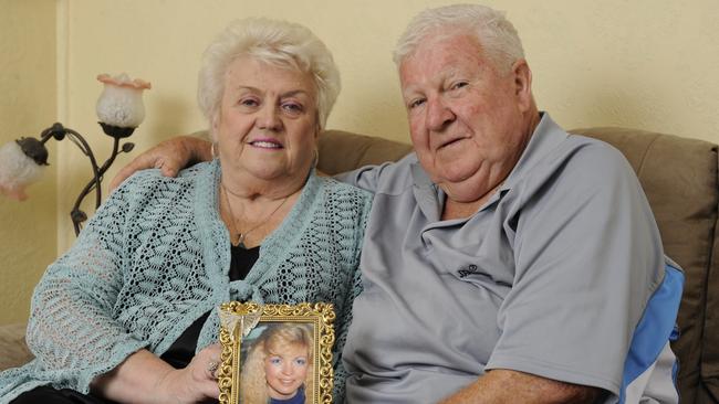 Crime Victims Support Association president Noel McNamara with wife Bev and a photo of their daughter Tracey who was murdered by her ex-boyfriend.