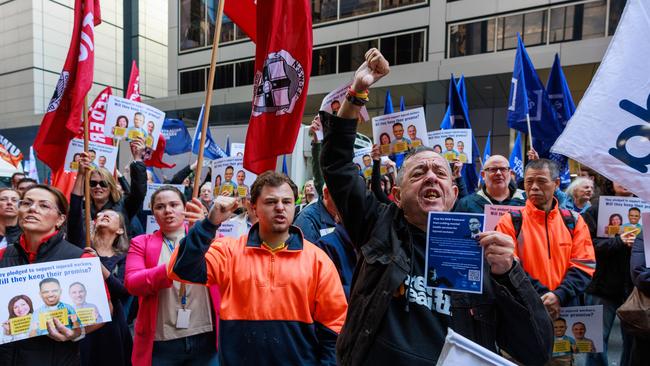 Union members rally outside 52 Martin Place, to oppose the government's proposed reforms to workers compensation. Picture: Justin Lloyd.
