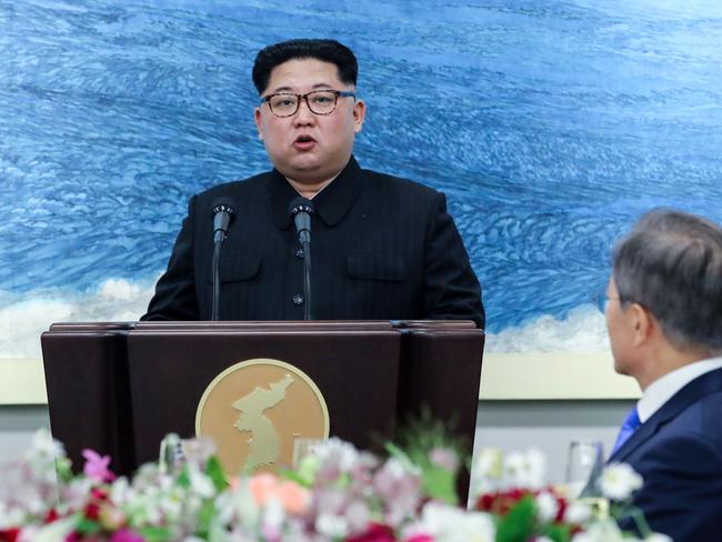 Kim Jong-un speaks as South Korea's President Moon Jae-in listens during the official dinner at the end of their historic summit. Picture: AFP