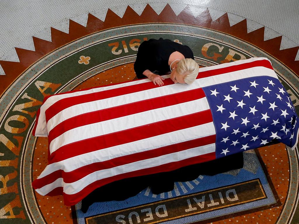 Cindy McCain, wife of US Senator John McCain, kisses his casket during a memorial service at the Arizona Capitol on August 29, 2018, in Phoenix. Picture: Ross D. Franklin/AFP