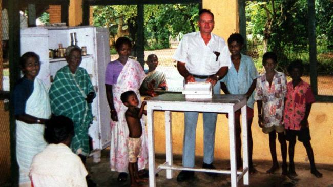 Australian missionary Graham Staines working with locals prior to being burnt to death with his two sons by anti-christian extremists in village in eastern State of Orissa, India