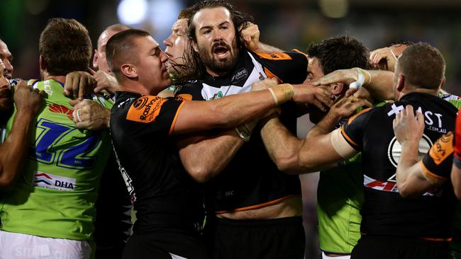 Raiders David Shillington headbutts Tigers Aaron Woods and gets sent from the field by Refere Jared Maxwell during the NRL game between the Canberra Raiders and the Wests Tigers at GIO Stadium,Canberra .Picture Gregg Porteous