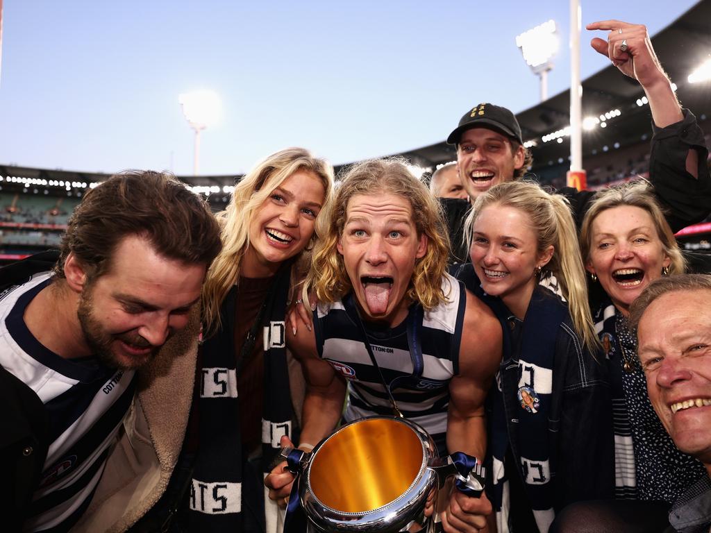 Sam De Koning of the Cats celebrates with family and friends after winning the 2022 AFL Grand Final. Picture: Cameron Spencer