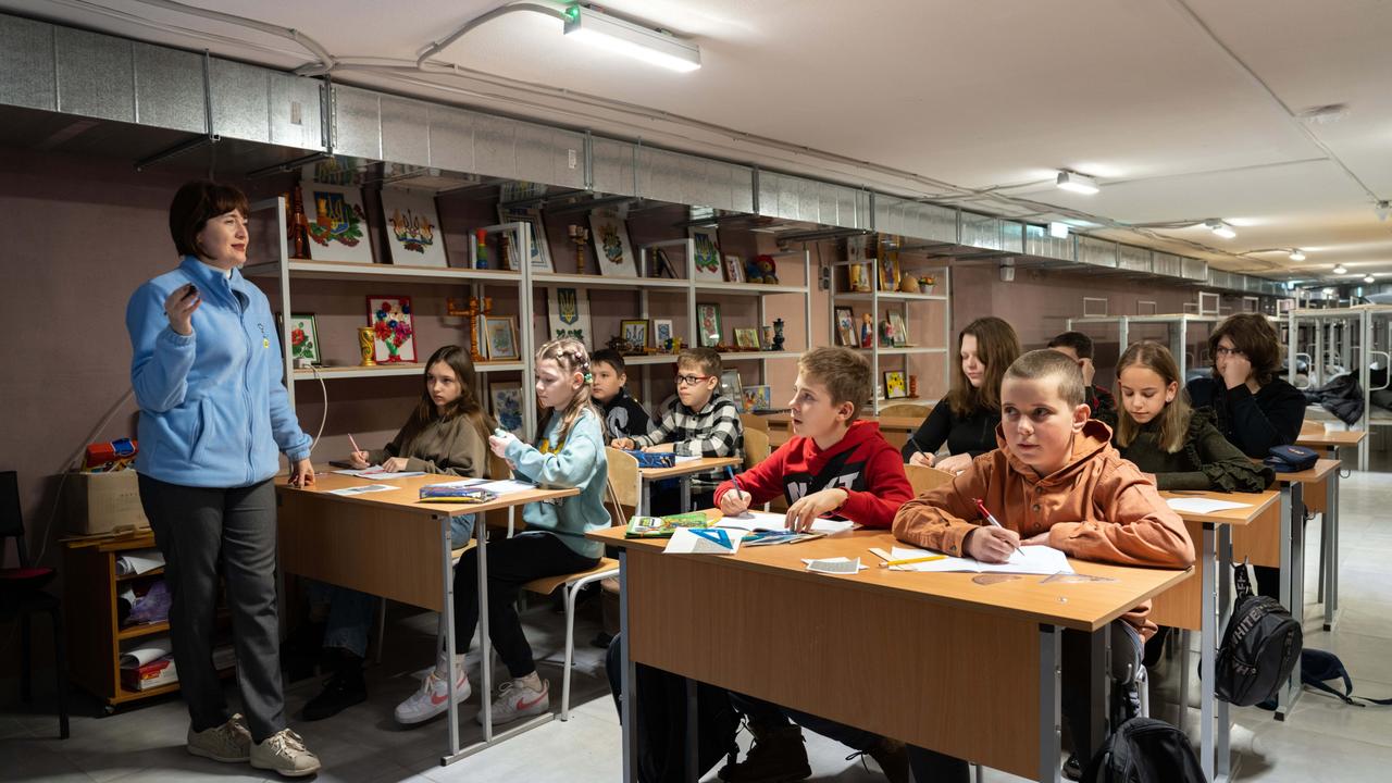 In the bomb shelter that lies beneath a school on the outskirts of Kharkiv in Ukraine, maths teacher Tetiana teaches her class. Picture: UNICEF/ Oleksii Filippov