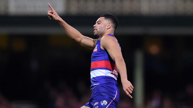 Jason Johannisen (right) of the Bulldogs celebrates kicking a goal during the round 15 AFL match between the Sydney Swans and the Western Bulldogs at Sydney Cricket Ground in Sydney on Saturday, July 2, 2016. (AAP Image/Paul Miller) NO ARCHIVING, EDITORIAL USE ONLY
