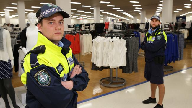 Constable Adam Rose and Sergeant Ian Church during a police operation targeting shoplifting at Warringah Mall