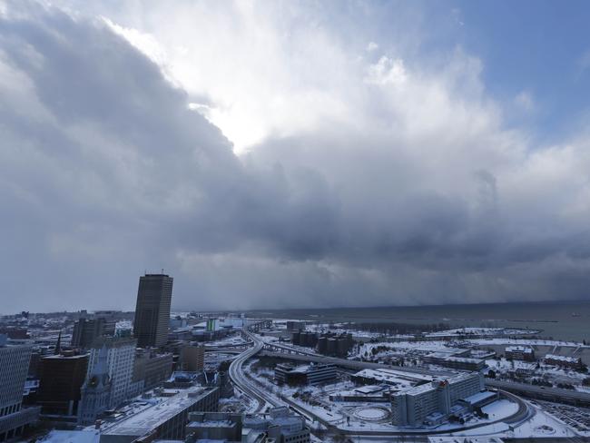 Thar she blows ... A massive band of lake effect snow moves through the south of Buffalo, New York on Tuesday. Pic: AP Photo/The Buffalo News, Derek Gee