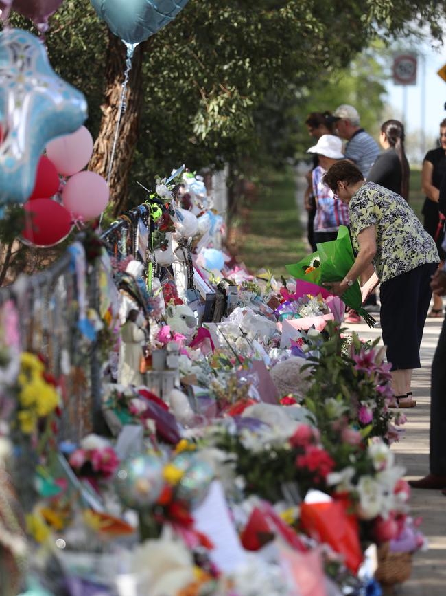 Mourners pay tribute at the scene of the crash in Oatlands in February. Picture: John Grainger