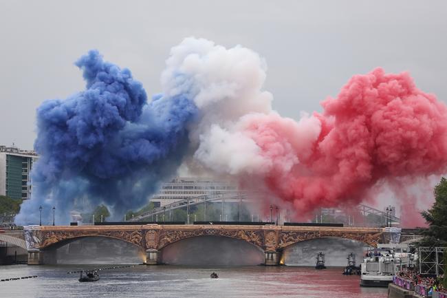 PARIS, FRANCE - JULY 26: Smoke resembling the flag of Team France is shown over Pont dÃ¢â&#130;¬â&#132;¢Austerlitz during the opening ceremony of the Olympic Games Paris 2024 on July 26, 2024 in Paris, France. (Photo by Lars Baron/Getty Images)