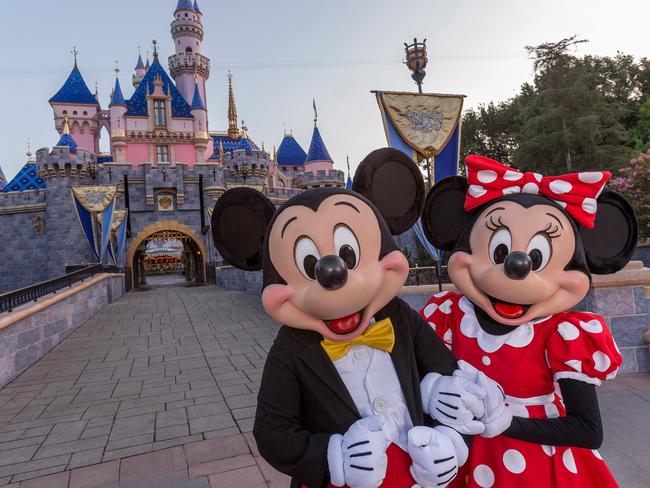 ESCAPE:  Standing in front of Sleeping Beauty Castle at Disneyland Park, Mickey Mouse and Minnie Mouse welcome visitors from all over the world. Combining classic favorites and exciting additions, the Disneyland Resort is an essential part of a Southern California vacation. (Joshua Sudock/Disneyland Resort)