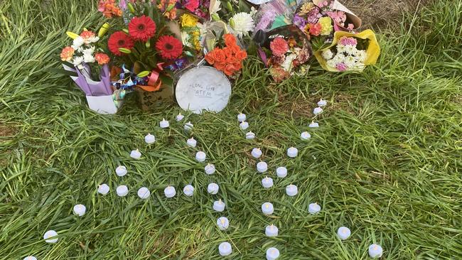 Floral tributes left at the scene of a fatal car crash at Edinburgh RAAF base. Picture: Todd Lewis