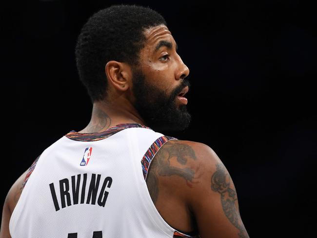 (FILES) In this file photo taken on January 11, 2020 Kyrie Irving #11 of the Brooklyn Nets looks on against the Atlanta Hawks at Barclays Center in New York City. - Brooklyn Nets star Kyrie Irving was among NBA players on a conference call who raised doubts about resuming the season as planned in a Florida quarantine, according to multiple reports. (Photo by Mike Stobe / GETTY IMAGES NORTH AMERICA / AFP)