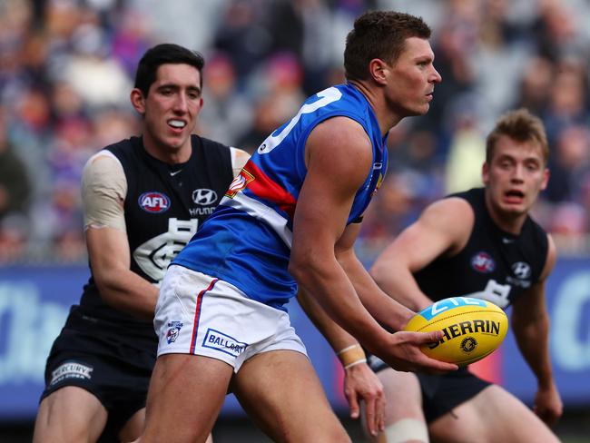 Jack Redpath fires out a handball for the Western Bulldogs. Picture: Michael Klein