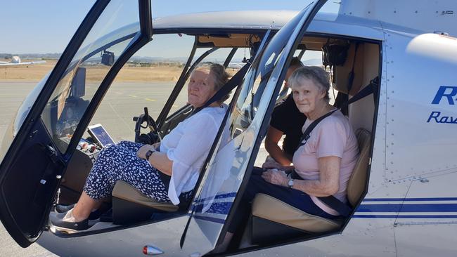 Cecile Kennedy, 77, and Joan Cousins, 81, prepare to take a ride in a helicopter and tick an item off their bucket list.