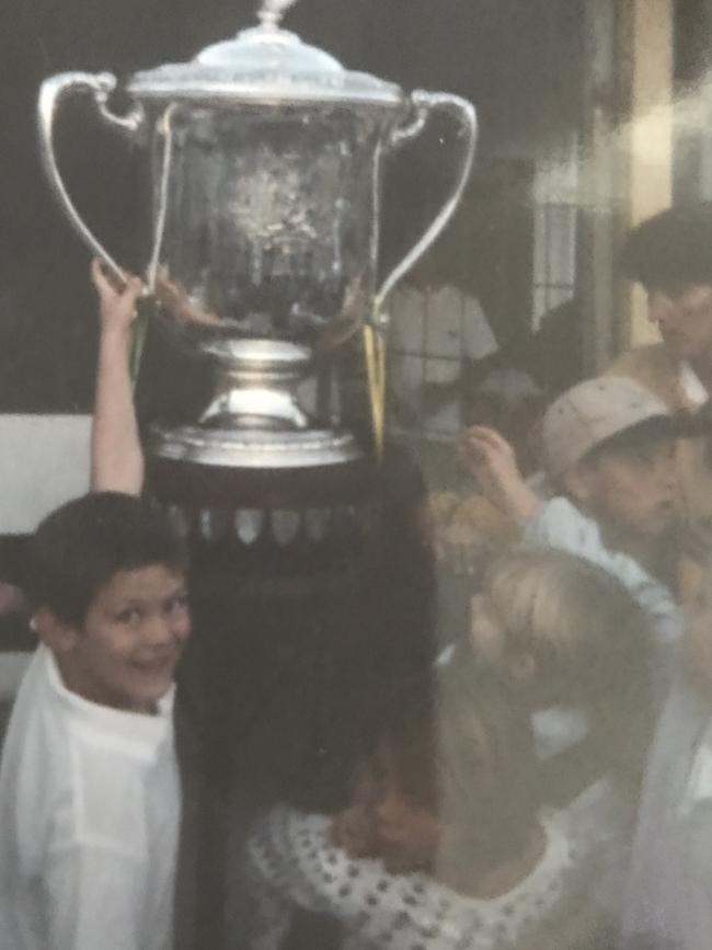 A young Michael Stolberg with the Bledisloe Cup at Caloundra.