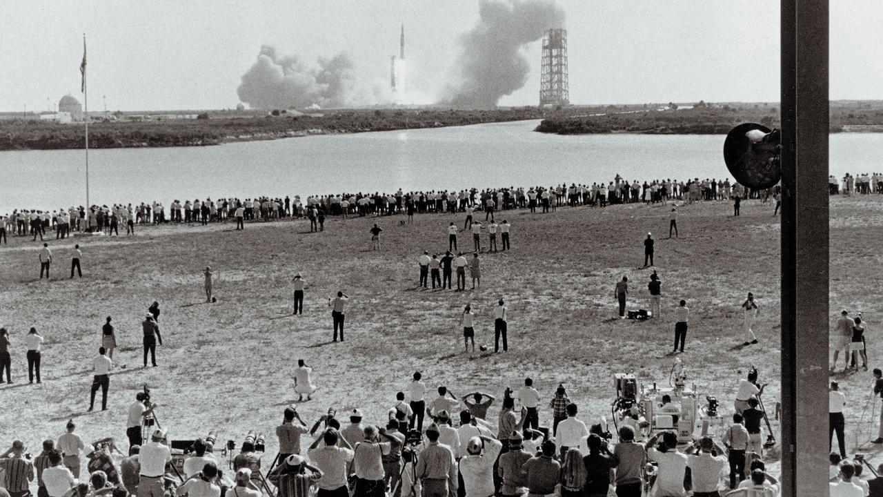 Some of the thousands of people who camped out on beaches and roads adjacent to the Kennedy Space Centre in Florida to watch the Apollo 11 mission liftoff in July 1969. Picture: AFP/NASA