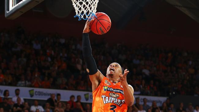 Taipans' Scott Machado completes an easy lay up in the National Basketball League (NBL) New Year's Eve match between the Cairns Taipans and the South East Melbourne Phoenix, held at the Cairns Convention Centre. PICTURE: BRENDAN RADKE.