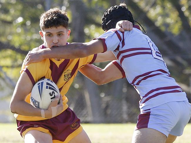 L to R: Holy Cross's Kayden Kanaan  and St Greg's Damon Potts. NRL Schoolboys Rugby League. Holy Cross College  (Yellow and maroon ) v St Gregory's College (blue and maroon). at Holy Cross College, Ryde. Picture: John Appleyard