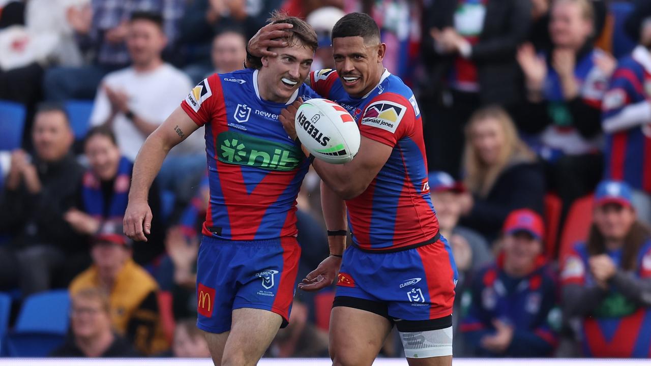 NEWCASTLE, AUSTRALIA - AUGUST 11: Fletcher Sharpe and k celebrates a try with during the round 23 NRL match between Newcastle Knights and Wests Tigers at McDonald Jones Stadium, on August 11, 2024, in Newcastle, Australia. (Photo by Scott Gardiner/Getty Images)