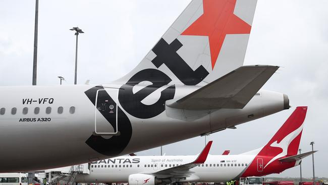 A Jetstar Airbus A320 and Qantas Boeing 737-800 aircraft. Picture: Brendan Radke