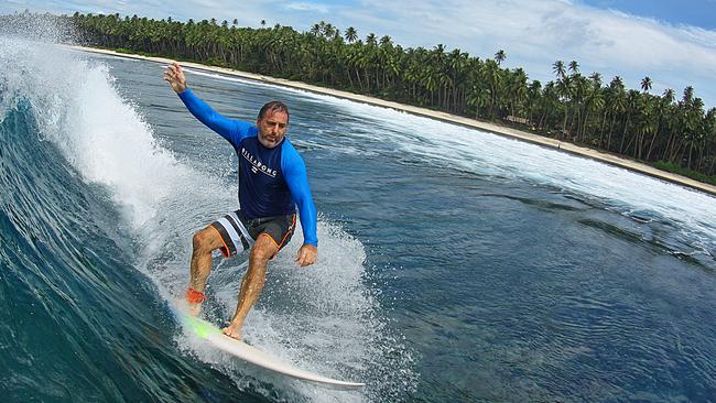 Consolidated Properties Group chairman of the board, Don O'Rorke, surfing in Indonesia.