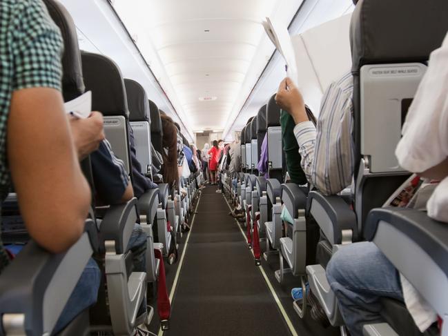 ESCAPE:  Passengers inside the cabin of a commercial airliner during flight. Shallow depth of field with focus on the seats in the foreground.  Picture: Istock