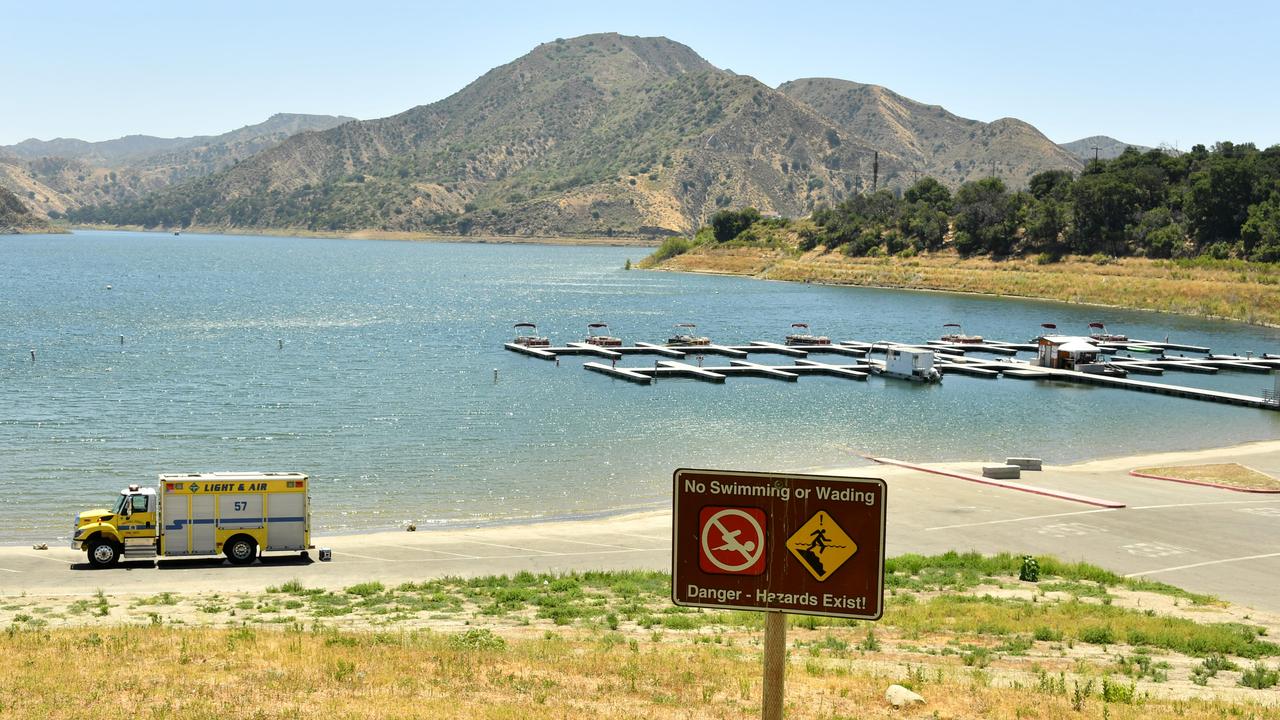 Dozens of officers searched the lake, which has strong currents and debris and plants hampering visibility and diving. Picture: Amy Sussman/Getty