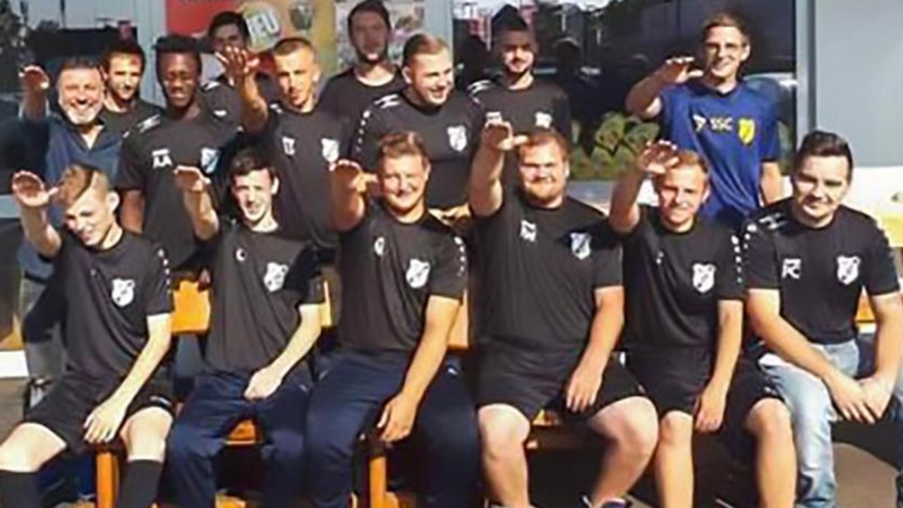 Players from German side SC1920 Mhyl's second team perform 'Nazi salutes' in a team photo.