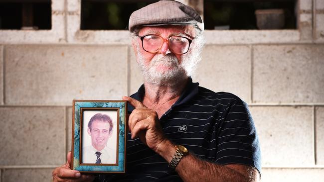 Mike Hodgens with a photo of his brother Reginald Hodgens. Picture: Zak Simmonds