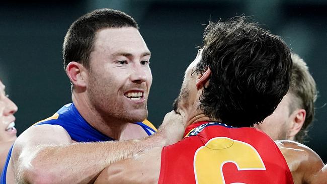 Jeremy McGovern of the Eagles (left) wrestles with Alex Sexton of the Suns during the Round 2 AFL match between the Gold Coast Suns and the West Coast Eagles at Metricon Stadium on the Gold Coast, Saturday, June 13, 2020. McGovern has since received a one match ban for striking Sexton. (AAP Image/Dave Hunt) NO ARCHIVING, EDITORIAL USE ONLY