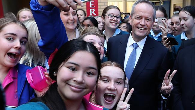 Bill Shorten is mobbed by schoolgirls at St Joseph’s Catholic College in East Gosford yesterday. Picture: Kym Smith