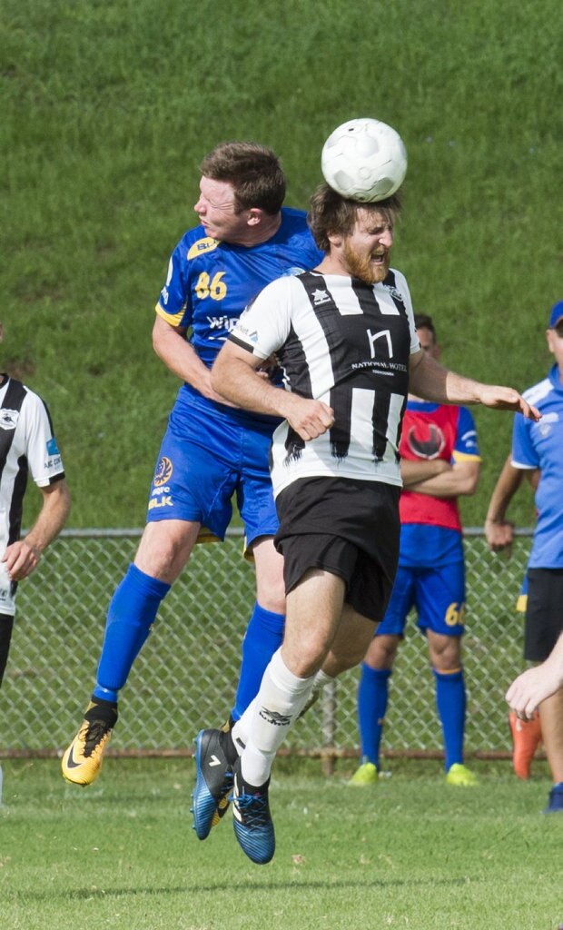 Brendan Willmot, USQ and Zachary Taylor, Willowburn. Football, Willowburn vs USQ. Sunday, 4th Mar, 2018. Picture: Nev Madsen