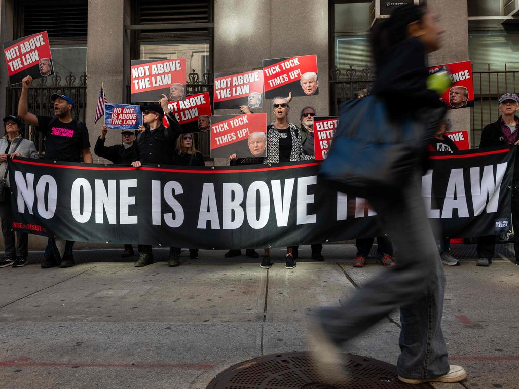 Critics of Donald Trump gather outside of the Manhattan Criminal Courthouse for the start of the first-ever criminal trial against a former president of the United States on April 15, 2024. Picture: Spencer Platt / Getty Images via AFP