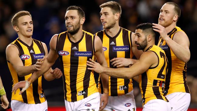 Harry Morrison, Jack Gunston, Ryan Schoenmakers, Paul Puopolo and Jarryd Roughead celebrate a goal.