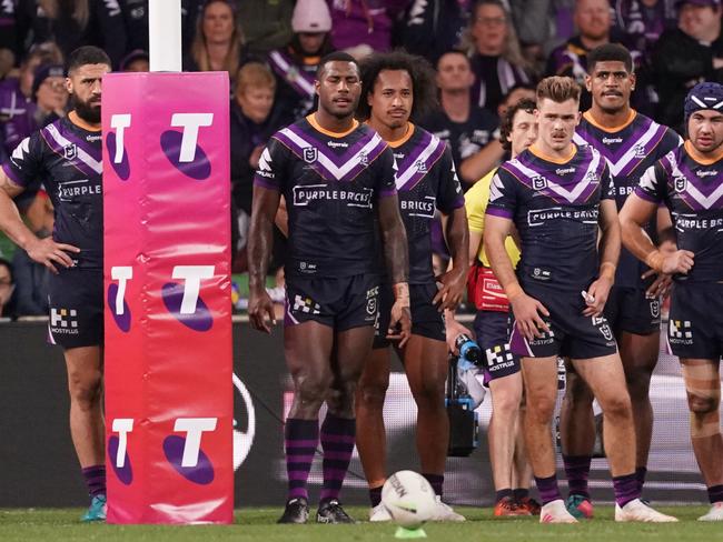 The Storm stand behind their goalline after the Raiders scored the winning try during the NRL Second Qualifying Final match between the Melbourne Storm and the Canberra Raiders at AAMI Park in Melbourne, Saturday, September 14, 2019.  (AAP Image/Scott Barbour) NO ARCHIVING, EDITORIAL USE ONLY