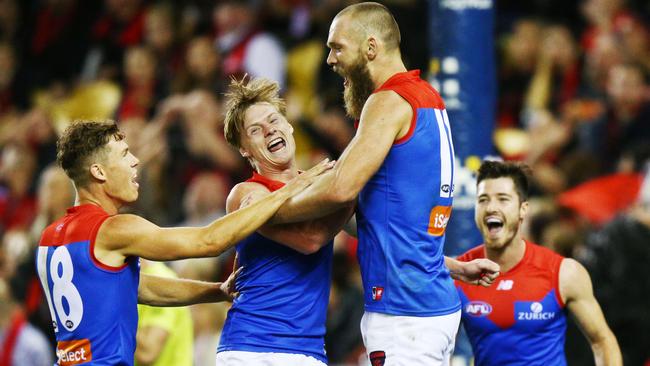 Max Gawn and the Demons celebrate their win over Essendon. Picture: Getty Images