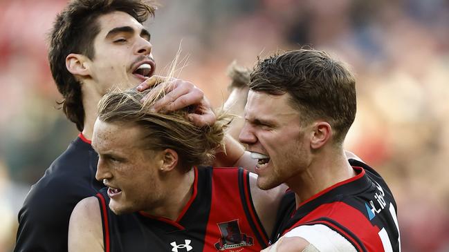 Teammates get around Mason Redman after his long bomb sailed through. Picture: Darrian Traynor/AFL Photos/via Getty Images