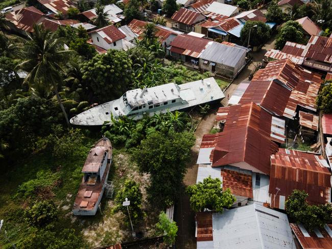 This aerial view shows two patrol boats washed ashore by the 2004 Indian Ocean tsunami in Banda Aceh. Picture: AFP